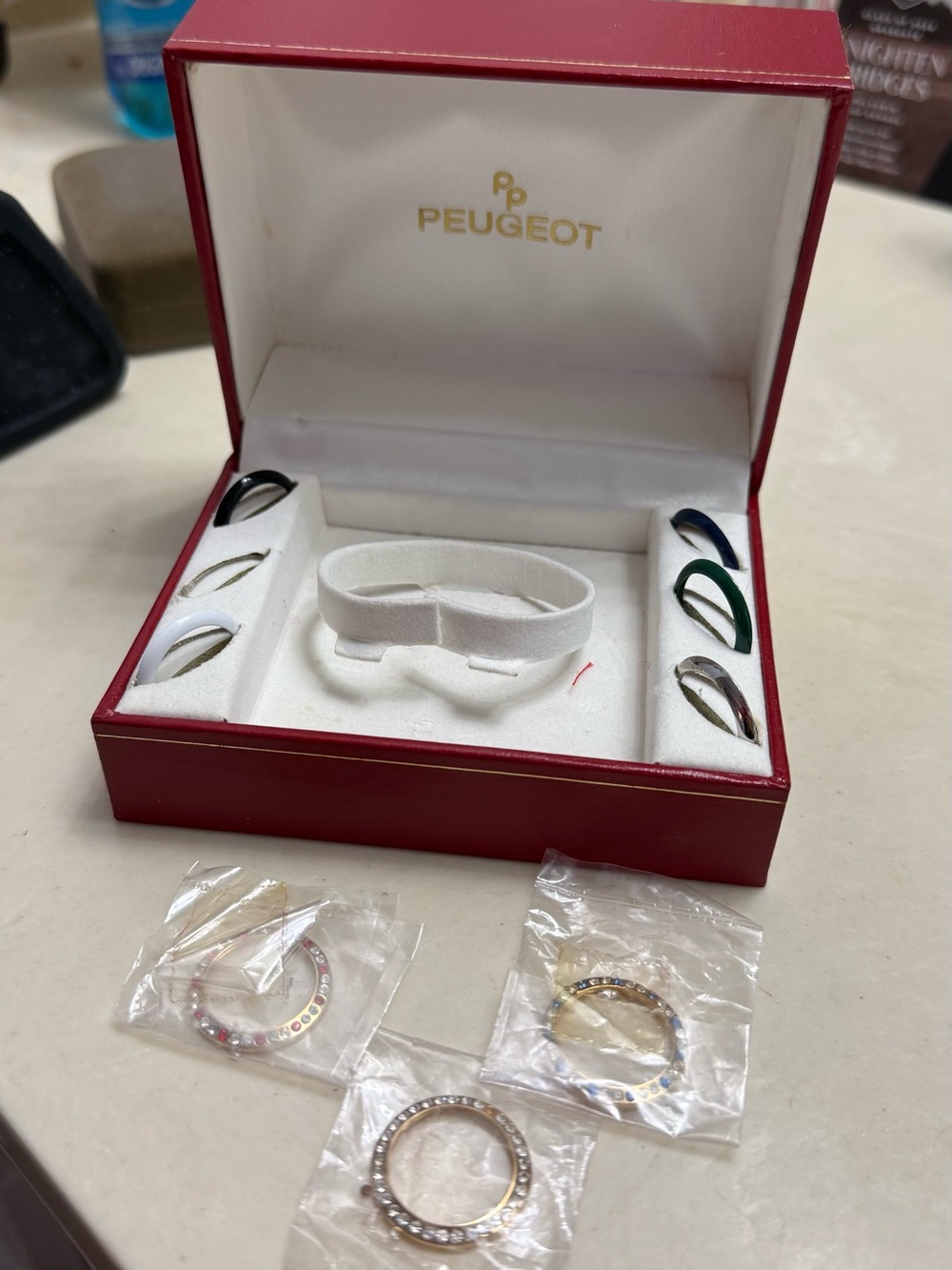 Peugeot Red Jewelry Case with Multicolor Ring Bezels and Rhinestone Rings